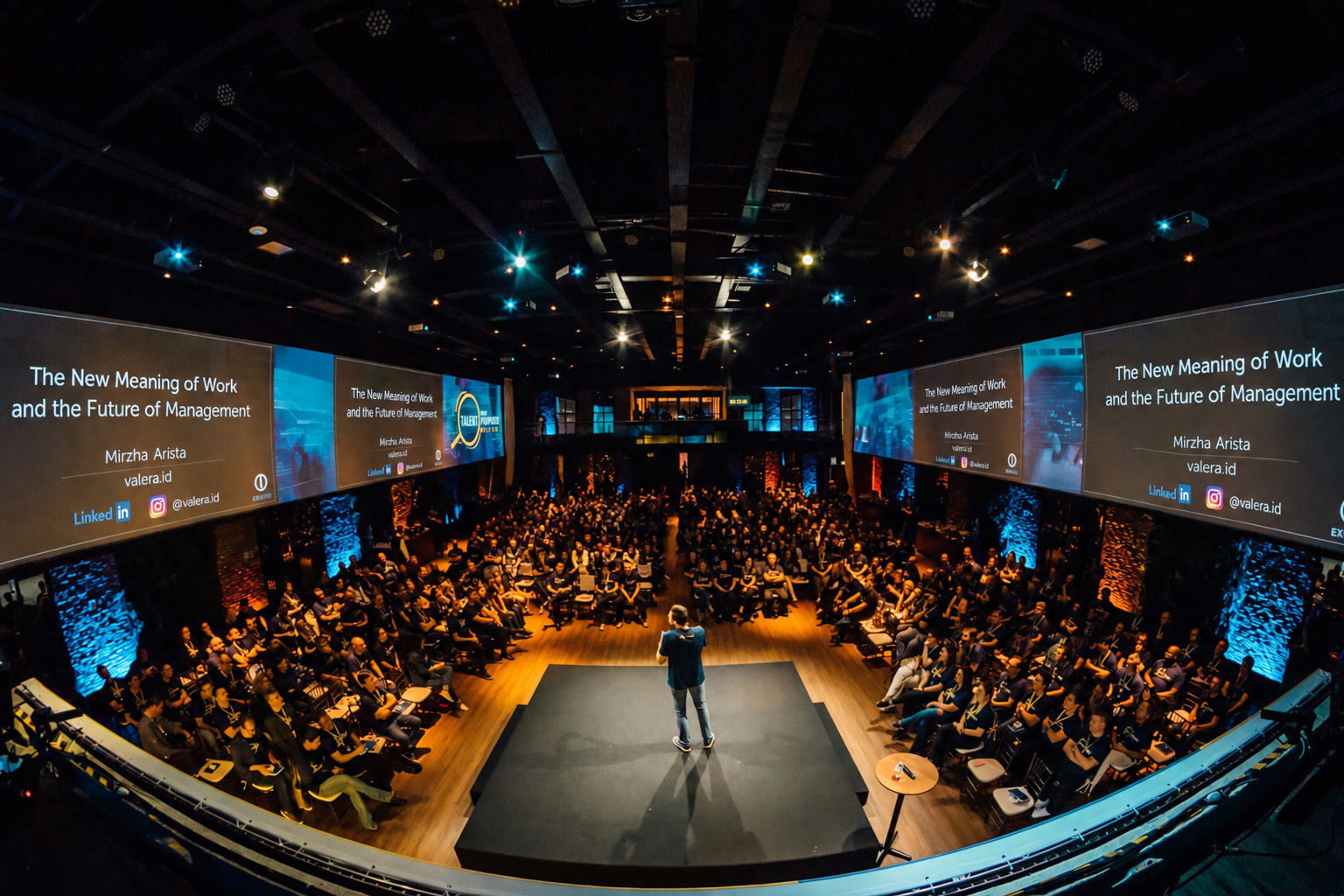 Mirzha presenting in front of an audience